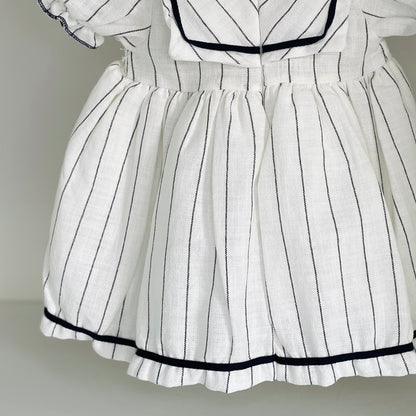 Robe bébé blanche a rayures noires