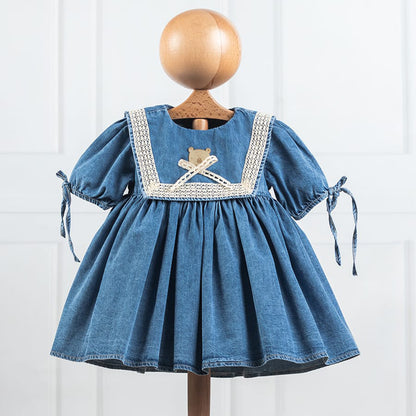 Robe bébé en jean bleu et broderie